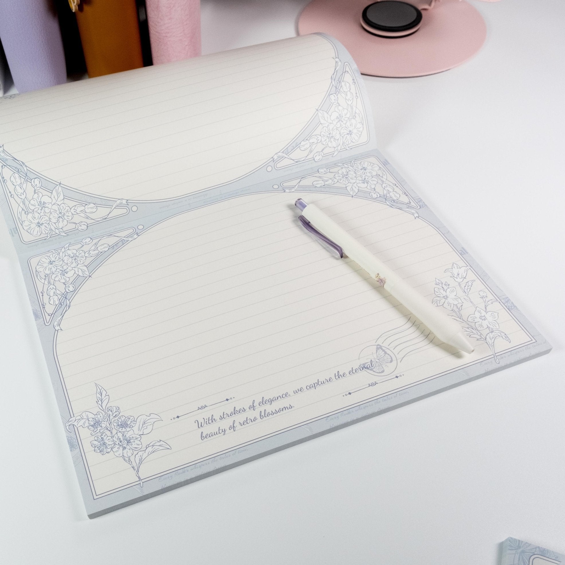 Horizontal Bellflower B5 notepad open with a pen placed on the page - Miouva