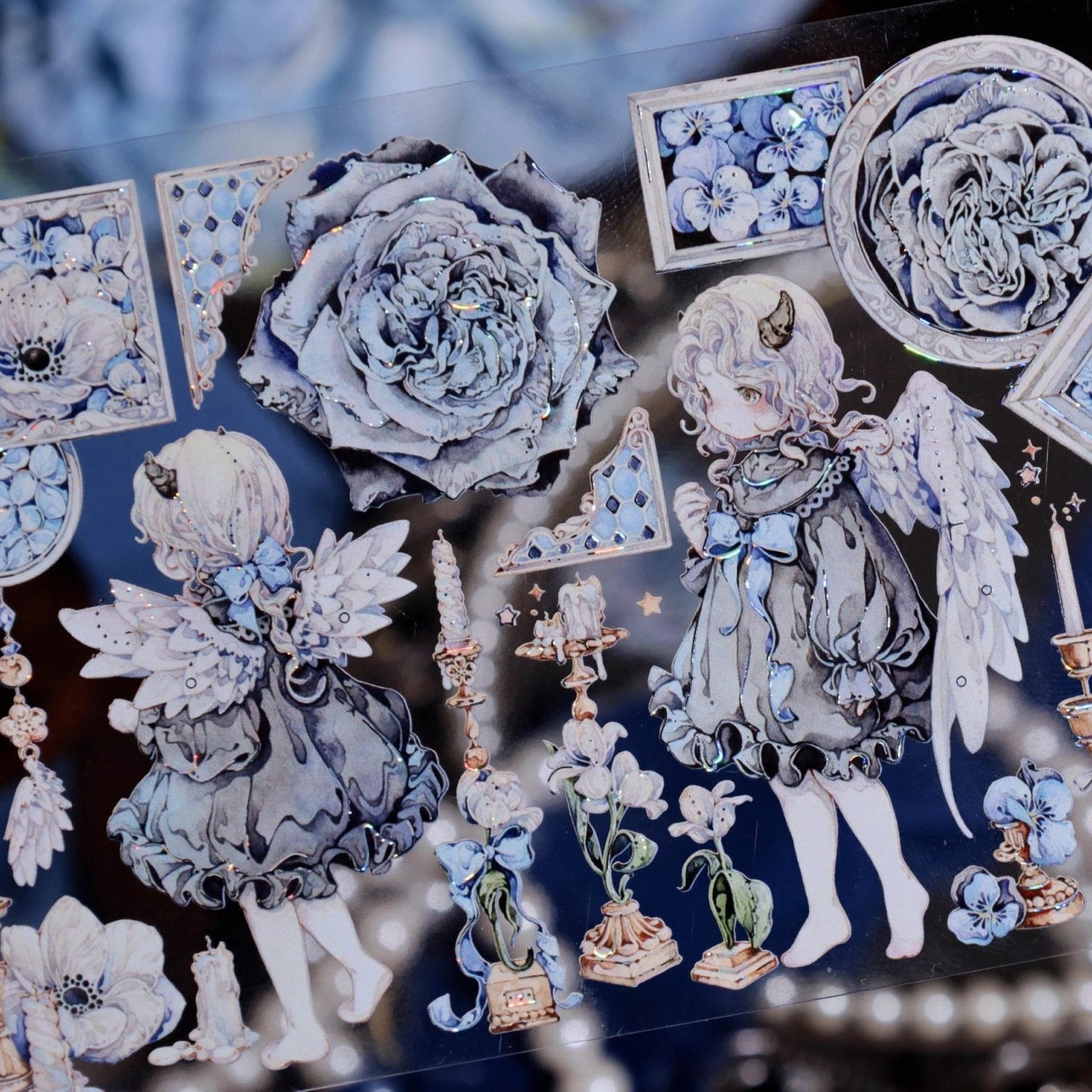 Close-up of Blue Angel PET Tape featuring two hand-drawn cherubs with rainbow iridescent glow - Miouva