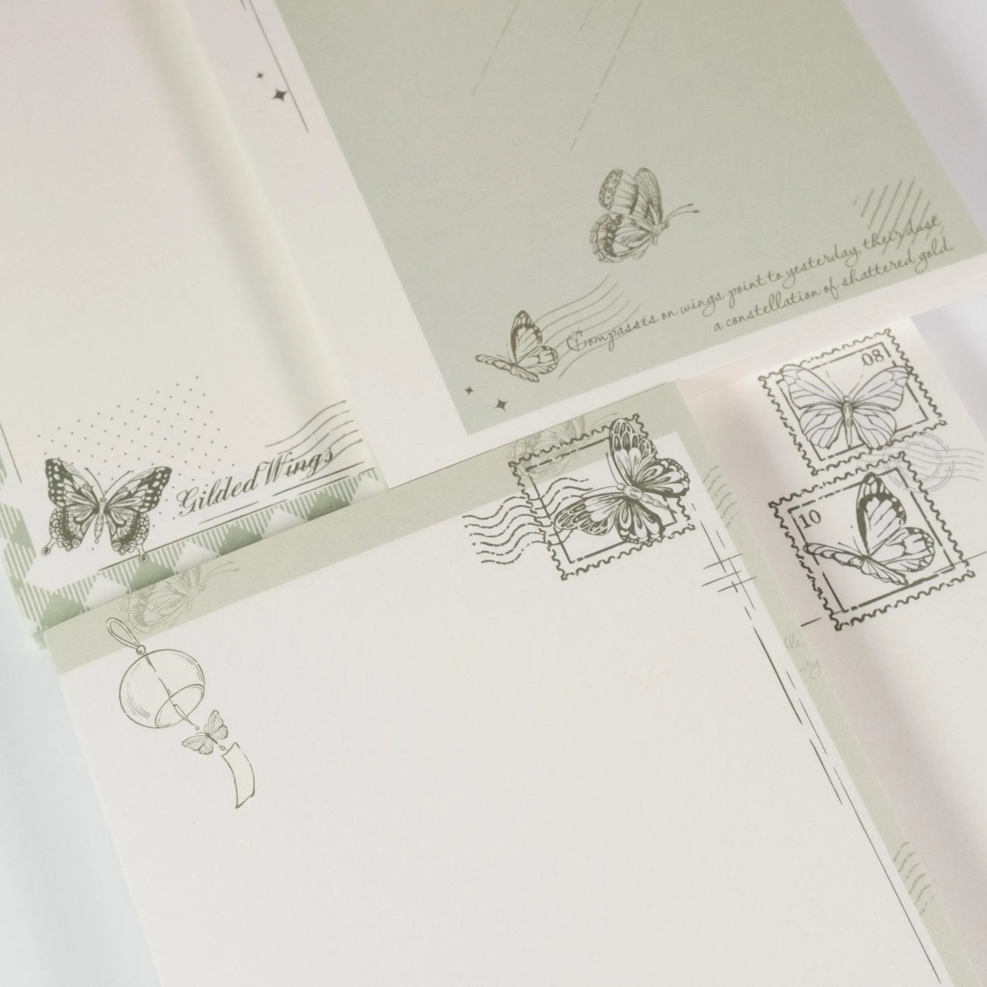 Close-up of butterfly stamp details and poetic typography on Butterfly Dreams paper - Miouva