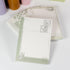 Stack of Butterfly Dreams notepads showing delicate postal-style layouts - Miouva