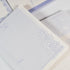 Close-up of Floral Fruits A6 notepad showing purple botanical details and paper texture - Miouva
