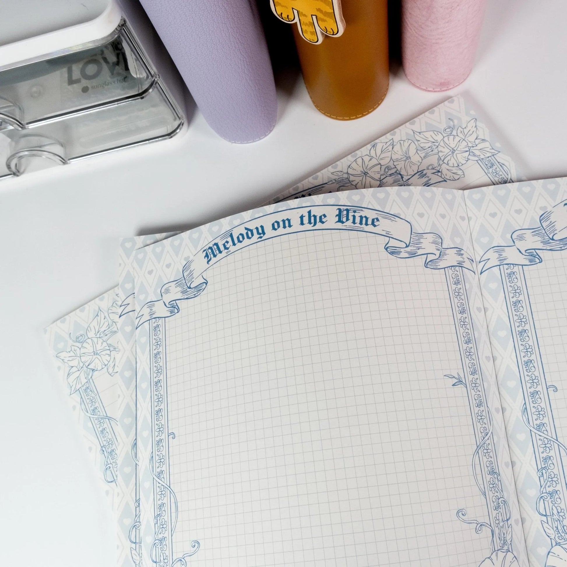 Vertical Morning Glory B5 notepad open showing grid page design - Miouva