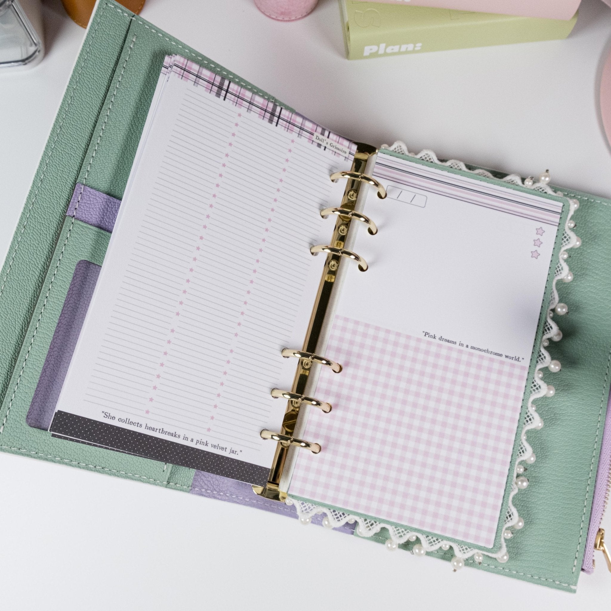 Pink & Ink Planner Refills displayed inside a personal planner binder showing black and pink contrast design - Miouva