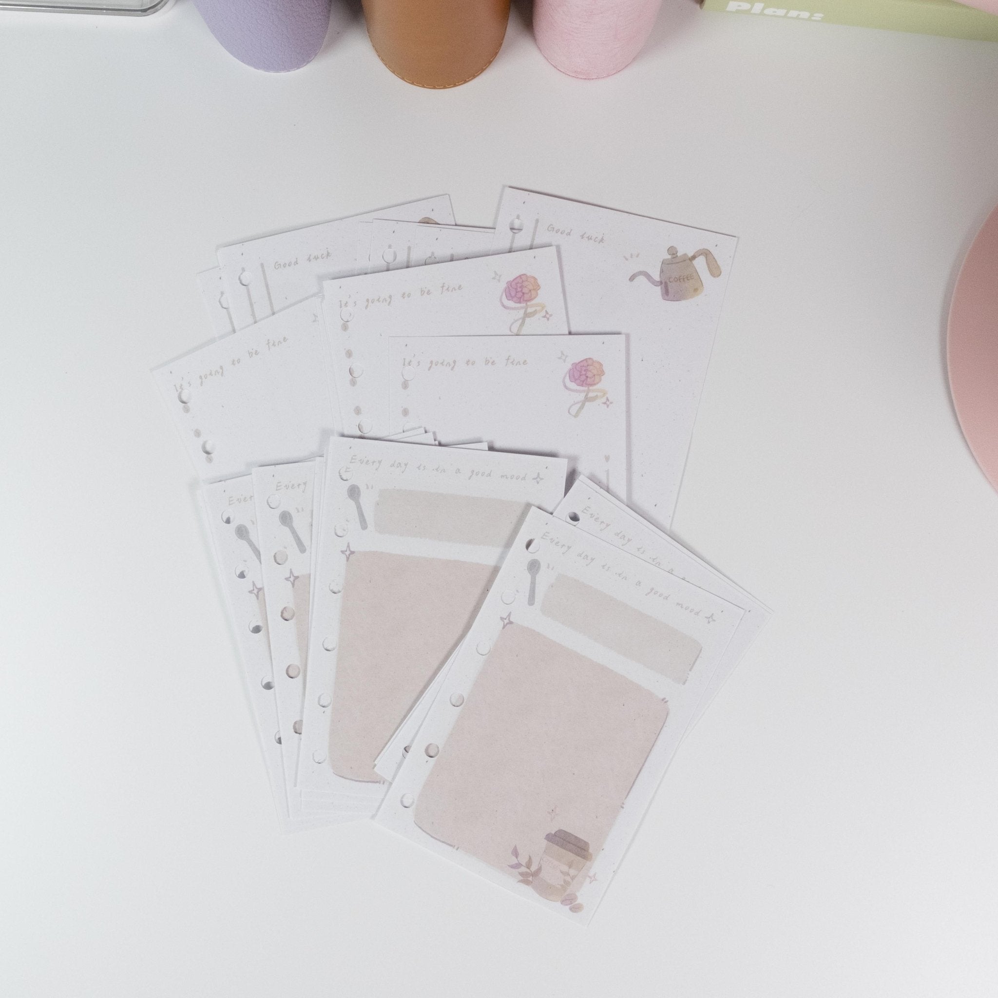 Flat lay of Pocket Coffee Notepad showing A6 size, tear-off design, and cosy hand-drawn coffee artwork - Miouva