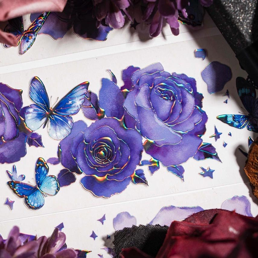 Close-up of hand-drawn purple roses and blue butterflies with shimmering holographic foil details - Miouva