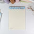 Cream lined B5 notepad page with seashell illustrations at the top - Miouva