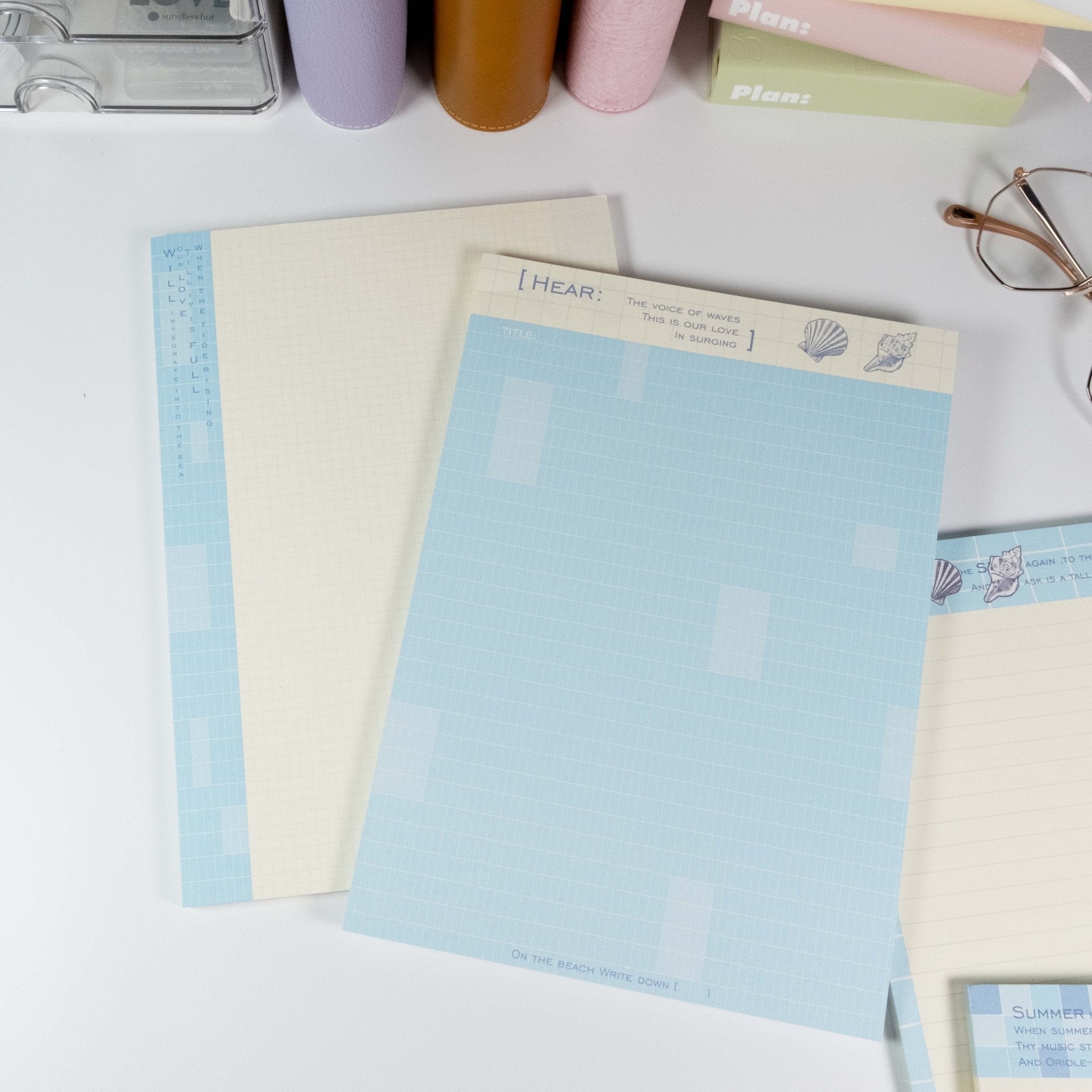 Flat lay of grid and lined notepad pages from Summer Beach B5 writing pad - Miouva