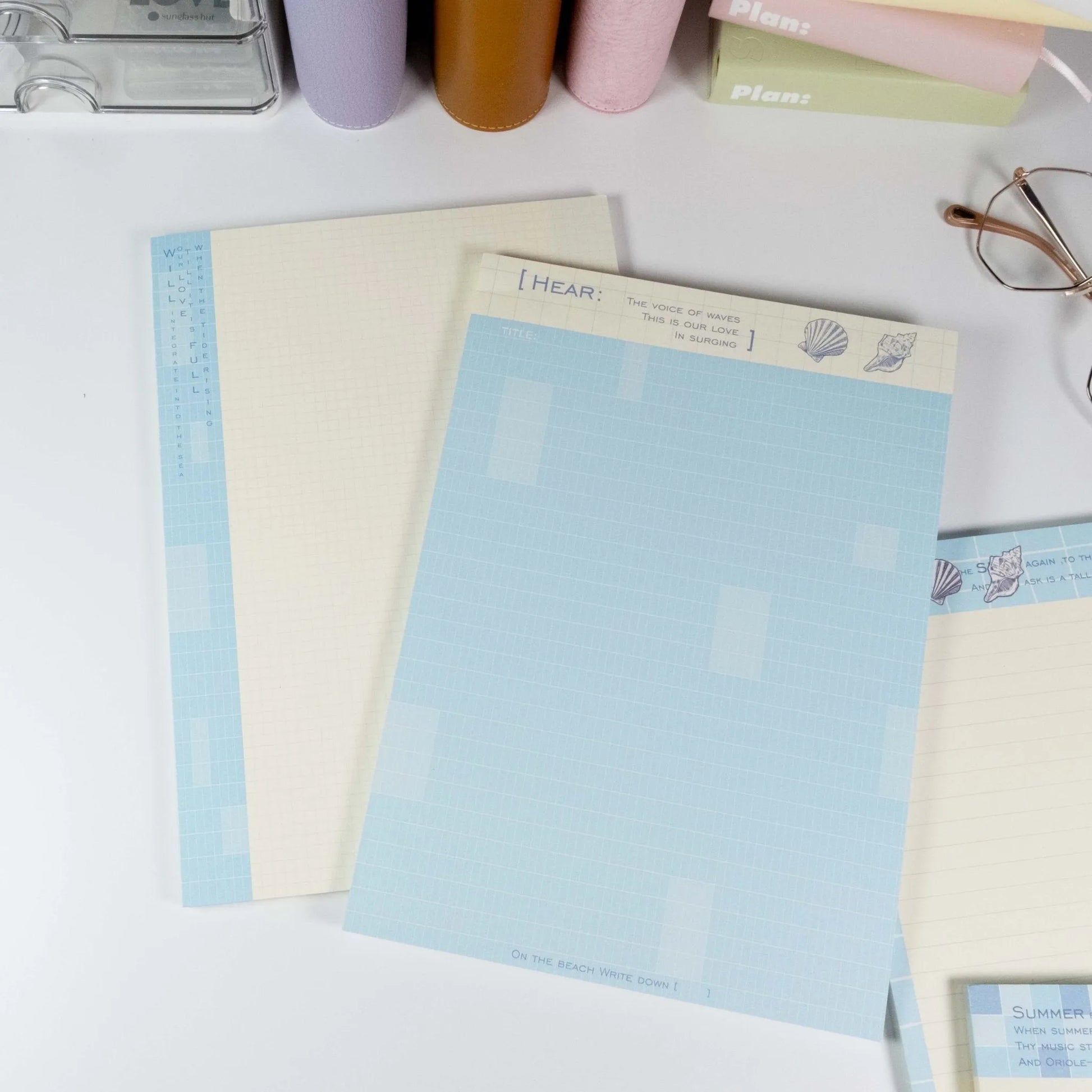 Flat lay of grid and lined notepad pages from Summer Beach B5 writing pad - Miouva