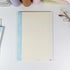 Single B5 notepad with blue grid pattern and coastal typography - Miouva