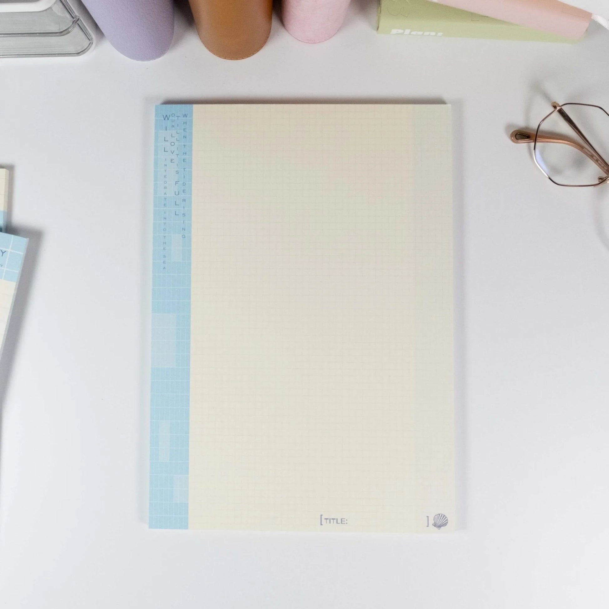 Single B5 notepad with blue grid pattern and coastal typography - Miouva