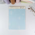 Assorted Summer Beach B5 notepads displayed with glasses and planners on desk - Miouva