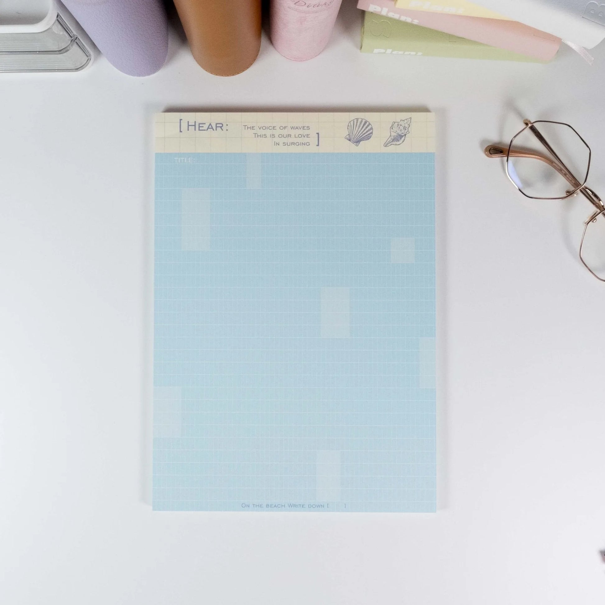 Assorted Summer Beach B5 notepads displayed with glasses and planners on desk - Miouva