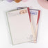 Flat lay of Vintage Train Postage Notepad showing A5 size, lined layout, and vintage travel-inspired artwork- Miouva
