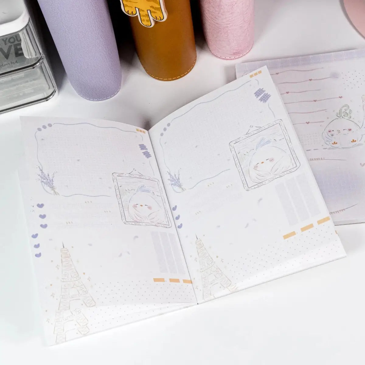 Inside pages of Little Chirp A6 Notepad featuring bird motifs and clean, minimal layout - Miouva